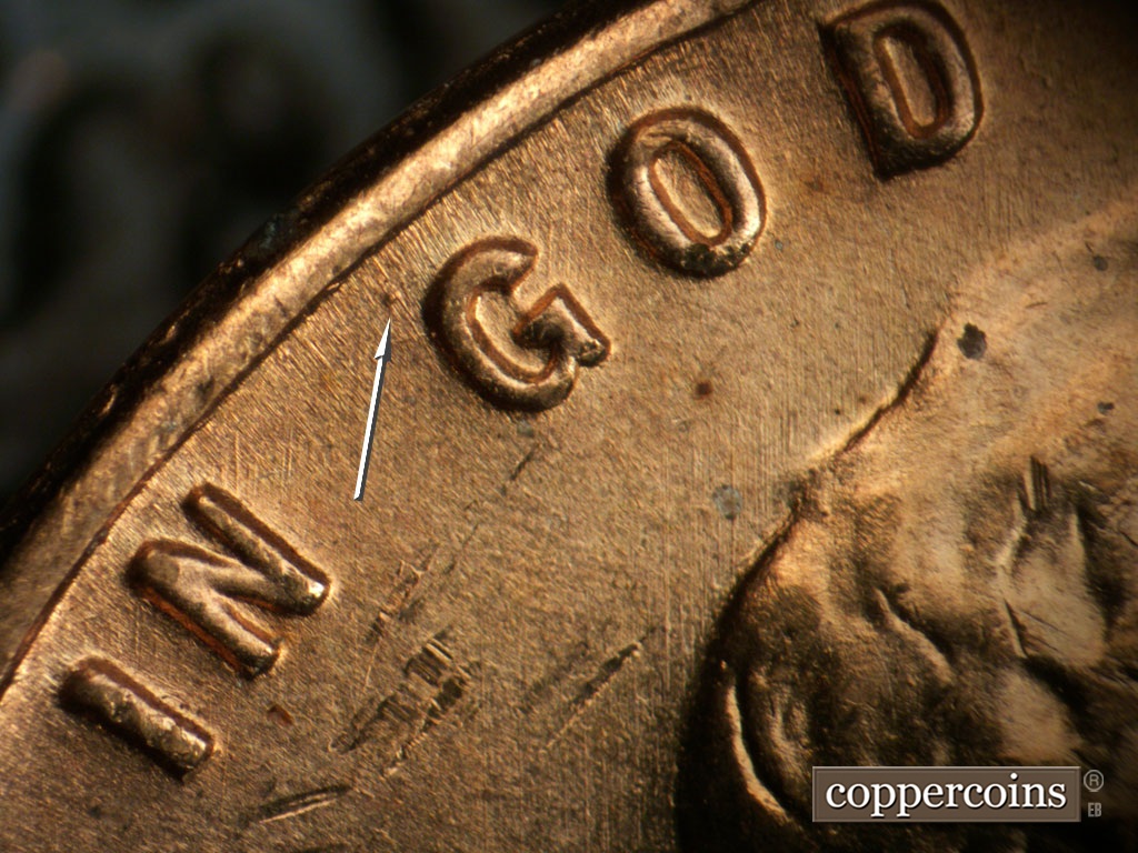 Die-stage A marker on 1955S•1MM•019 showing Die dot near G in GOD.