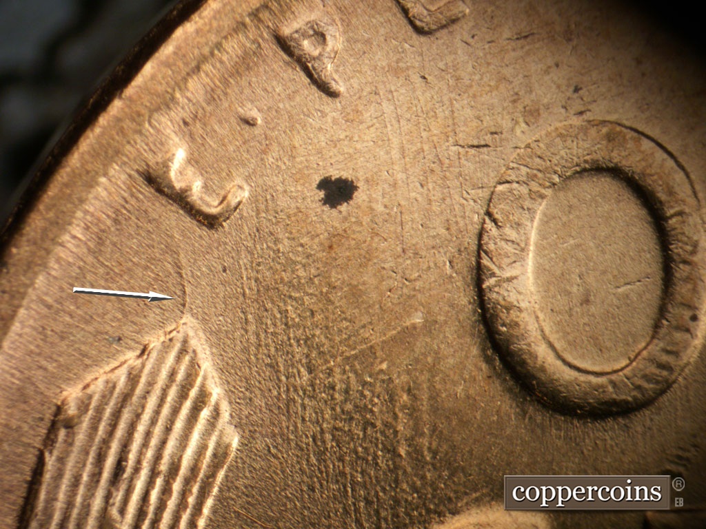 Die-stage A marker on 1955S•1MM•019 showing Die crack from tip of left wheat stalk.