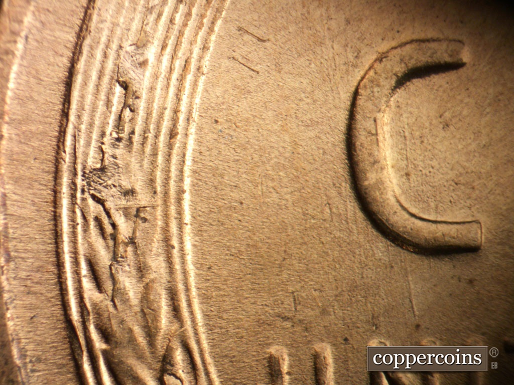 Die-stage A marker on 1955S•1MM•019 showing Die break on middle left wheat stalk.
