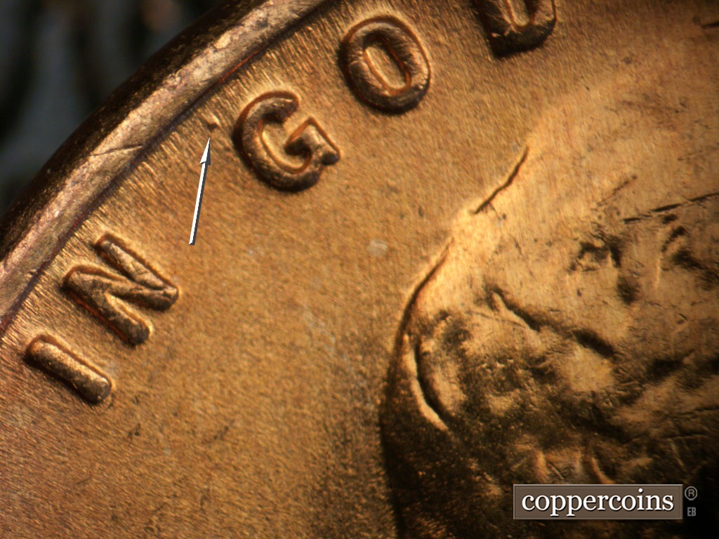 Die-stage B marker on 1955S•1MM•019 showing Die dot near G in GOD.