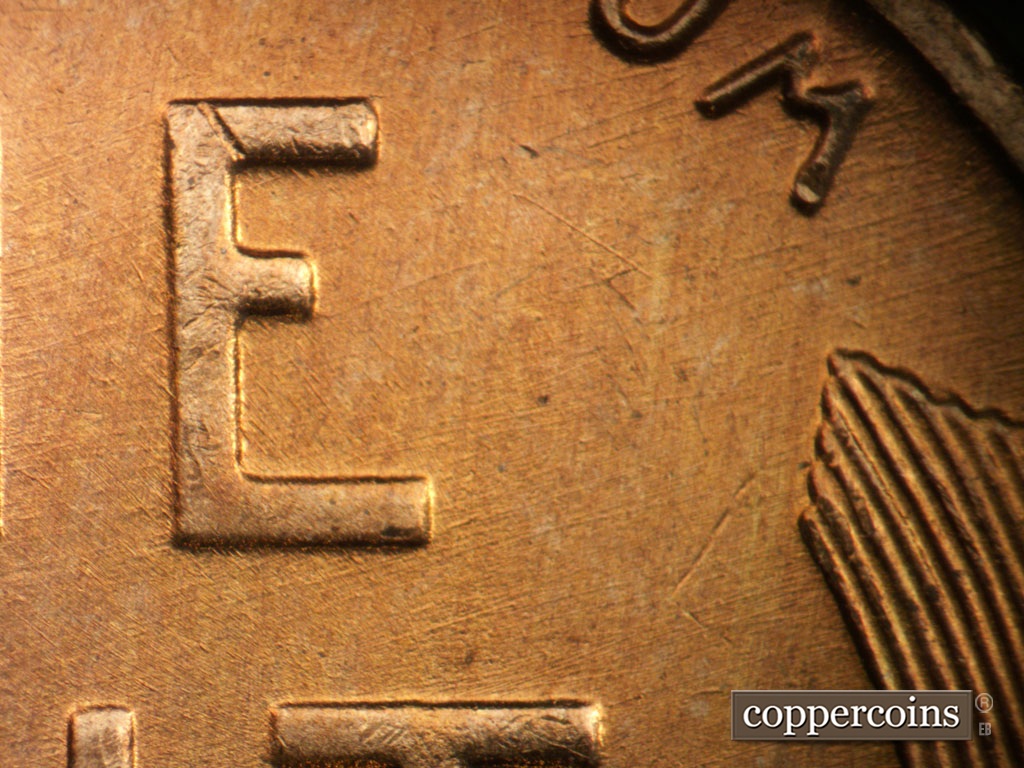 Die-stage B marker on 1955S•1MM•019 showing Die scratches in upper right of obverse.