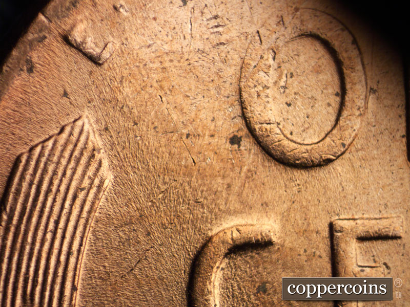 Die-stage B marker on 1956D•1DO•001 (1956 Doubled Die Obverse).
