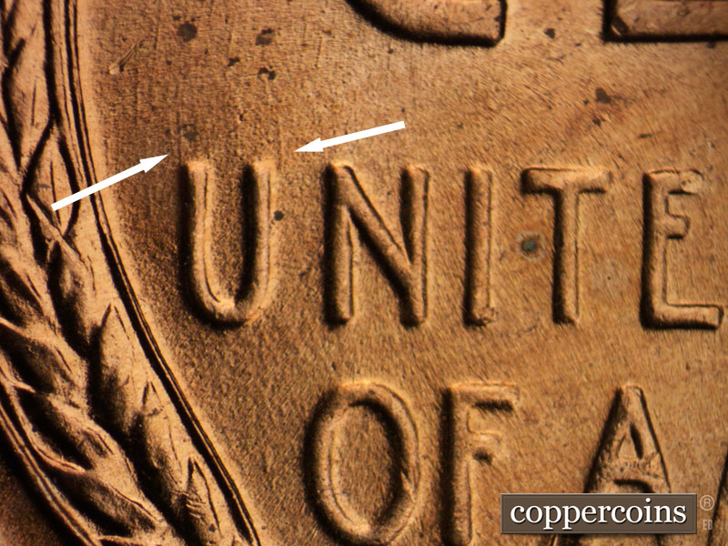 Die-stage B marker on 1956D•1DO•012 (1956 Doubled Die Obverse).
