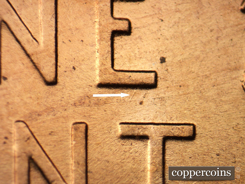Die-stage B marker on 1956D•1DO•012 (1956 Doubled Die Obverse).