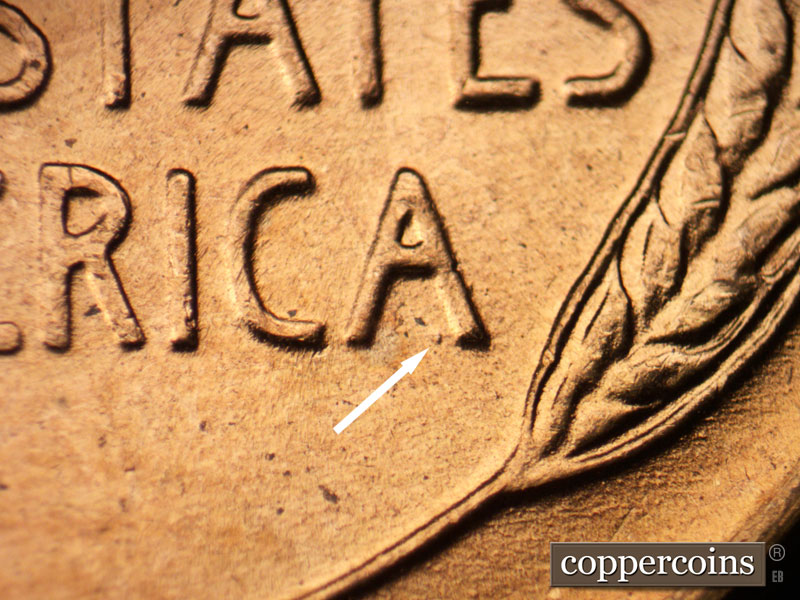 Die-stage B marker on 1956D•1DO•012 (1956 Doubled Die Obverse).