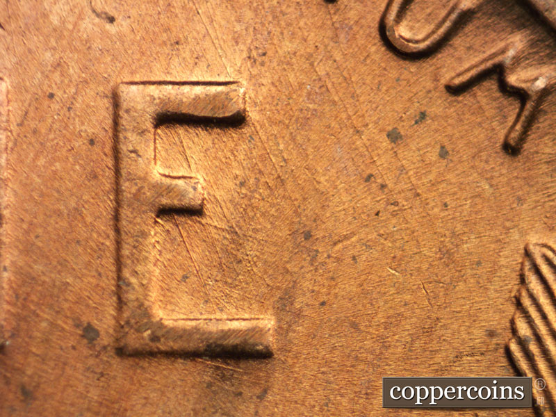 Die-stage B marker on 1956D•1DO•016 (1956 Doubled Die Obverse).