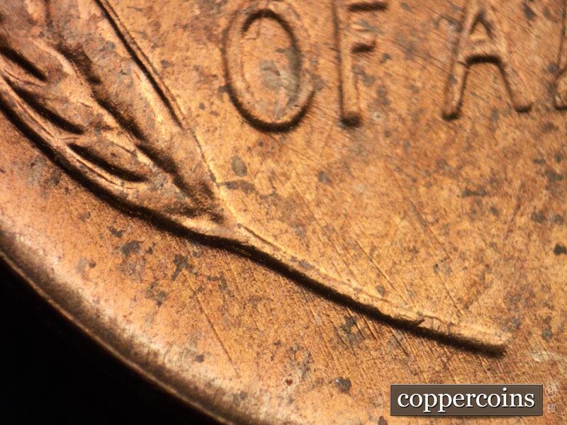 Die-stage B marker on 1956D•1DO•016 (1956 Doubled Die Obverse).