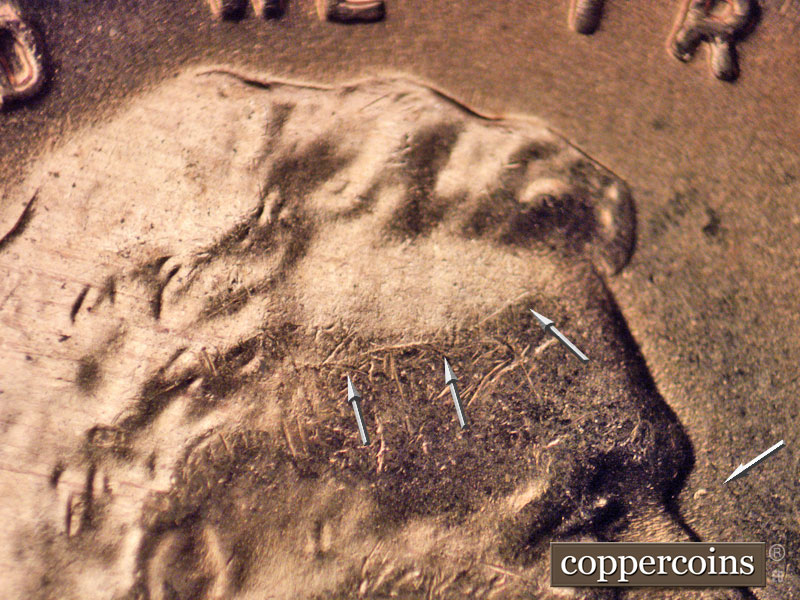 Die-stage B marker on 1956D•1DO•024 (1956 Doubled Die Obverse).