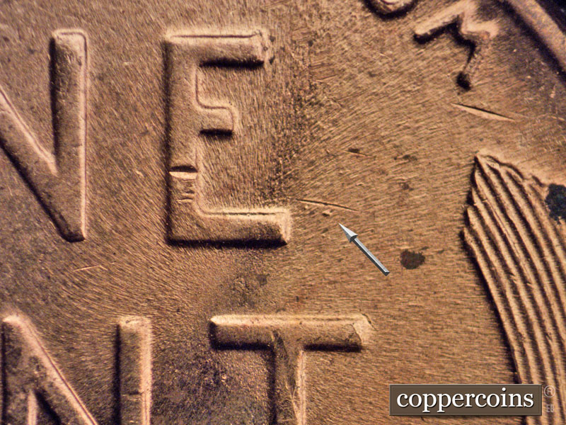 Die-stage B marker on 1956D•1DO•024 (1956 Doubled Die Obverse).