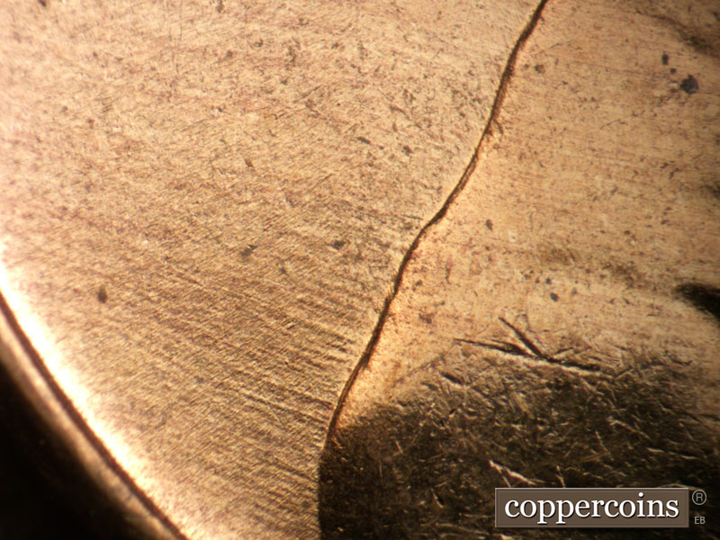 Die-stage B marker on 1956D•1DO•026 (1956 Doubled Die Obverse).