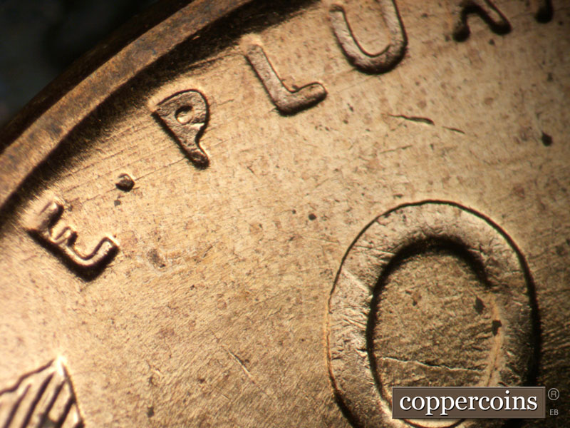Die-stage B marker on 1956D•1DO•026 (1956 Doubled Die Obverse).