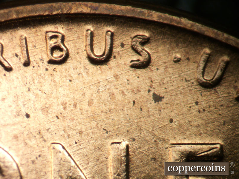 Die-stage B marker on 1956D•1DO•026 (1956 Doubled Die Obverse).