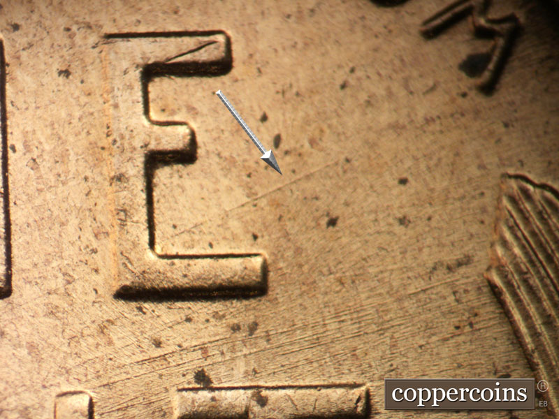 Die-stage B marker on 1956D•1DO•026 (1956 Doubled Die Obverse).