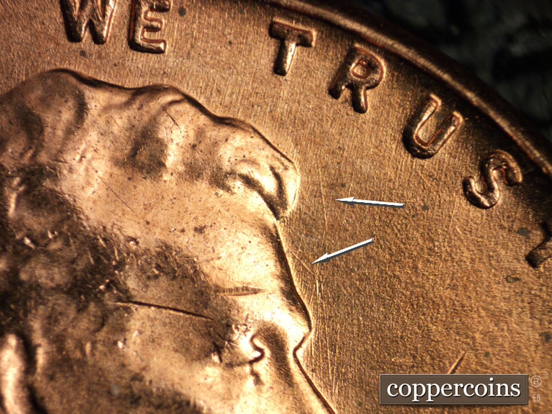 Die-stage B marker on 1956D•1DO•027 (1956 Doubled Die Obverse).