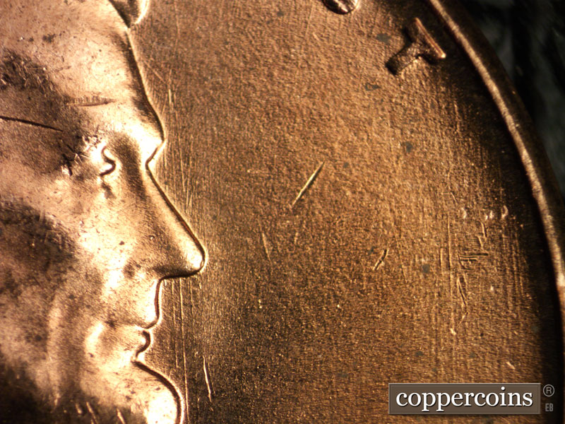 Die-stage B marker on 1956D•1DO•027 (1956 Doubled Die Obverse).