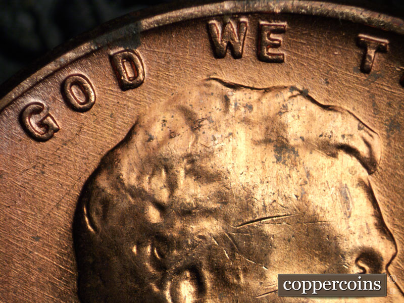Die-stage B marker on 1956D•1DO•028 (1956 Doubled Die Obverse).