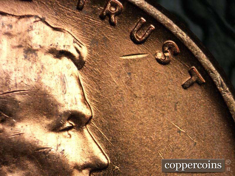 Die-stage B marker on 1956D•1DO•028 (1956 Doubled Die Obverse).