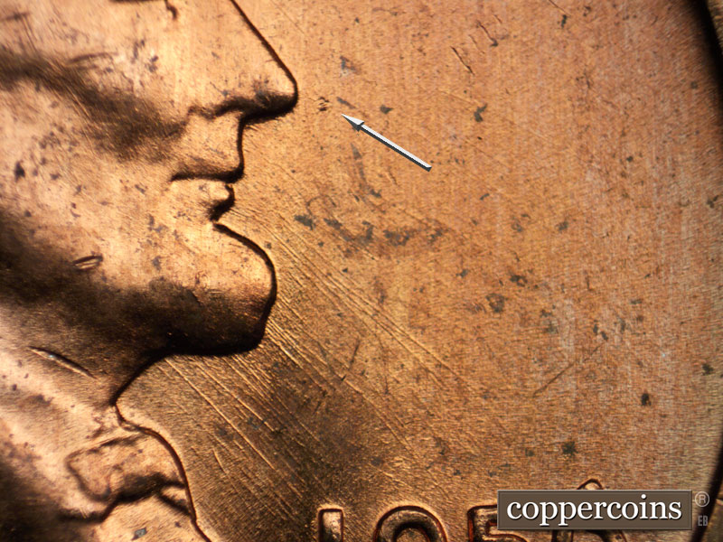Die-stage B marker on 1956D•1DO•028 (1956 Doubled Die Obverse).
