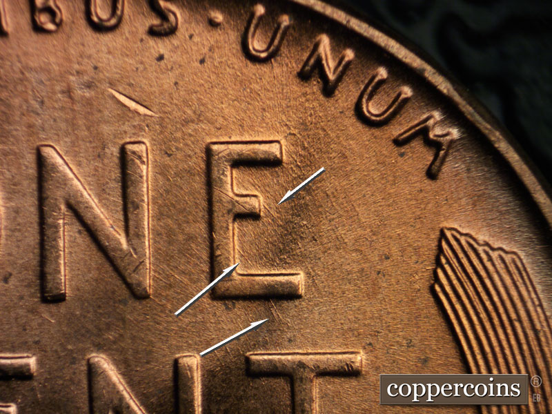 Die-stage B marker on 1956D•1DO•028 (1956 Doubled Die Obverse).