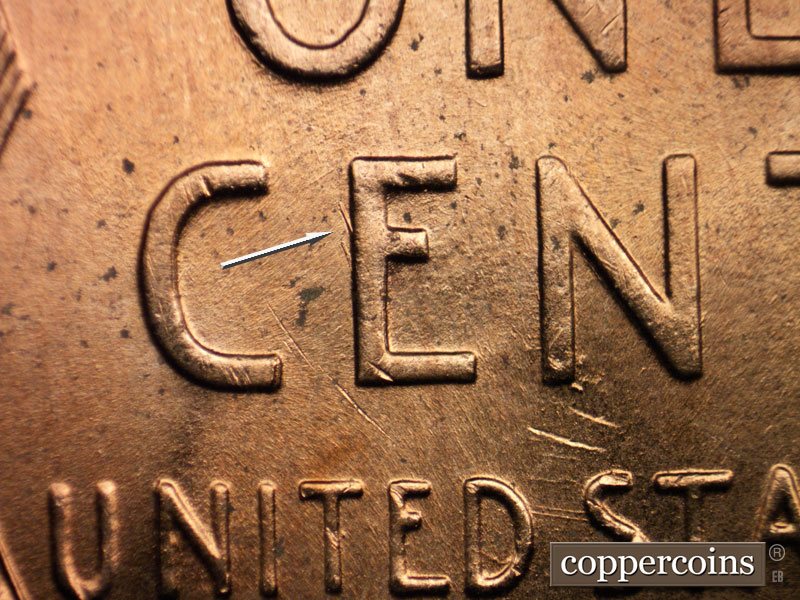 Die-stage B marker on 1956D•1DO•028 (1956 Doubled Die Obverse).