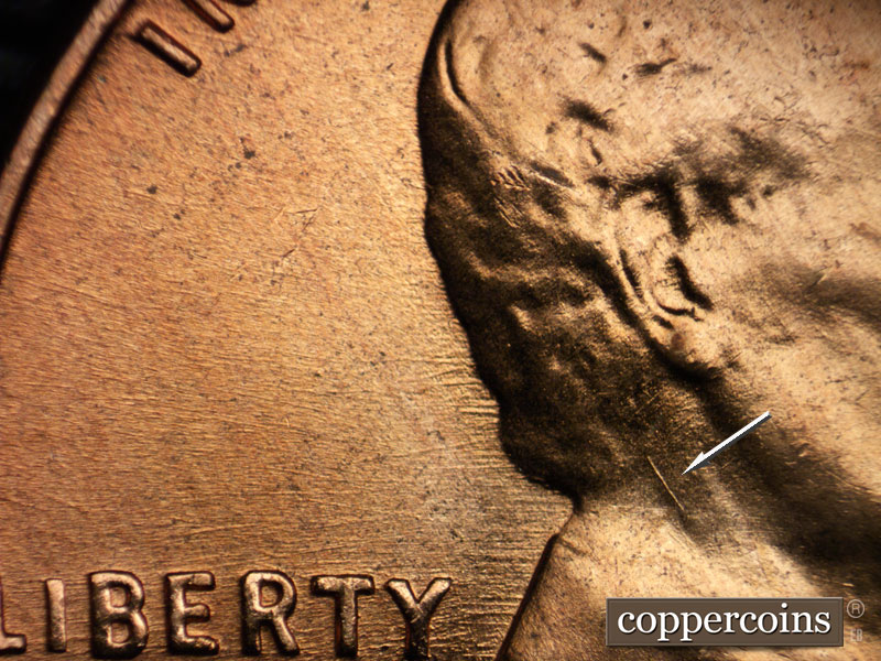 Die-stage B marker on 1956D•1DO•029 (1956 Doubled Die Obverse).