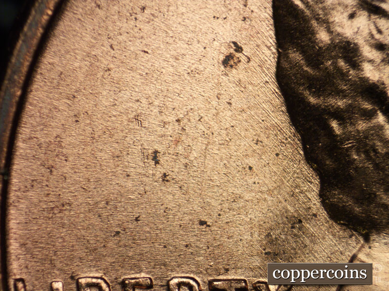 Die-stage B marker on 1956D•1DO•031 (1956 Doubled Die Obverse).