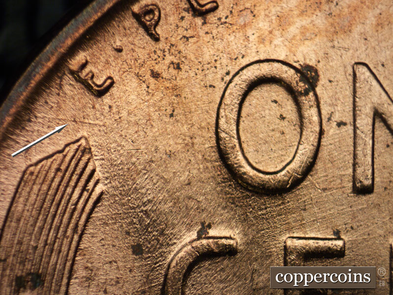Die-stage B marker on 1956D•1DO•031 (1956 Doubled Die Obverse).