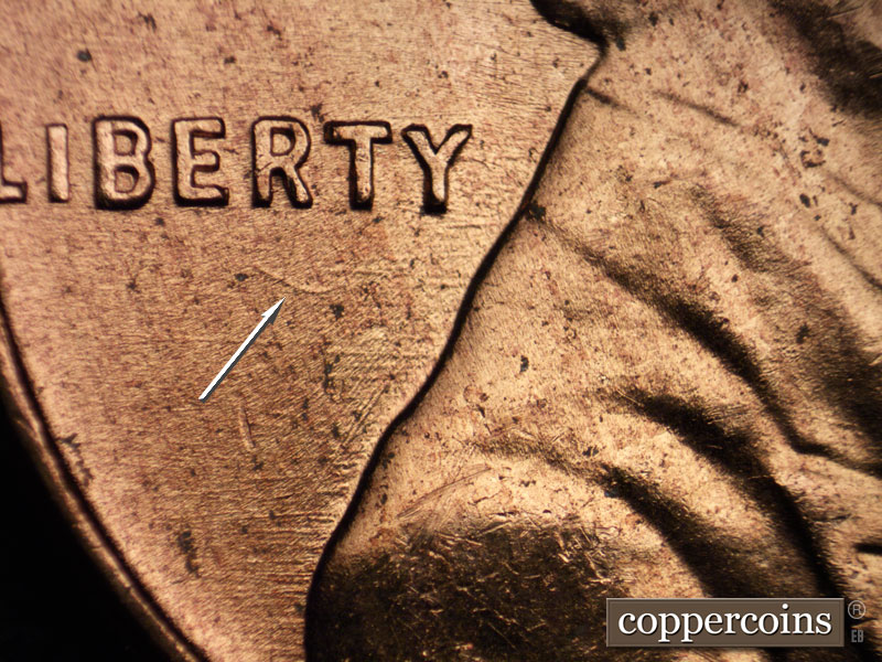 Die-stage B marker on 1956D•1DO•032 (1956 Doubled Die Obverse).