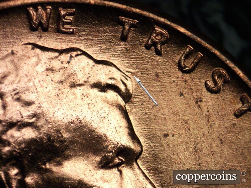 Die-stage B marker on 1956D•1DO•032 (1956 Doubled Die Obverse).