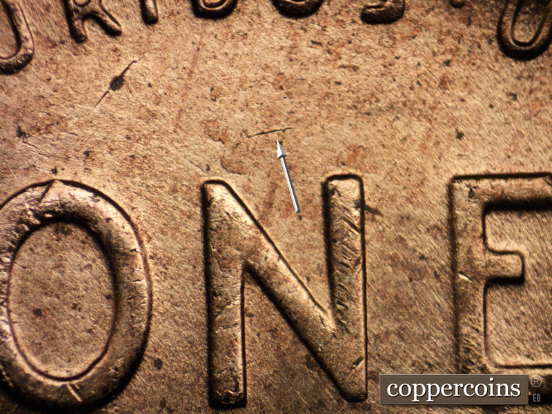 Die-stage B marker on 1956D•1DO•032 (1956 Doubled Die Obverse).