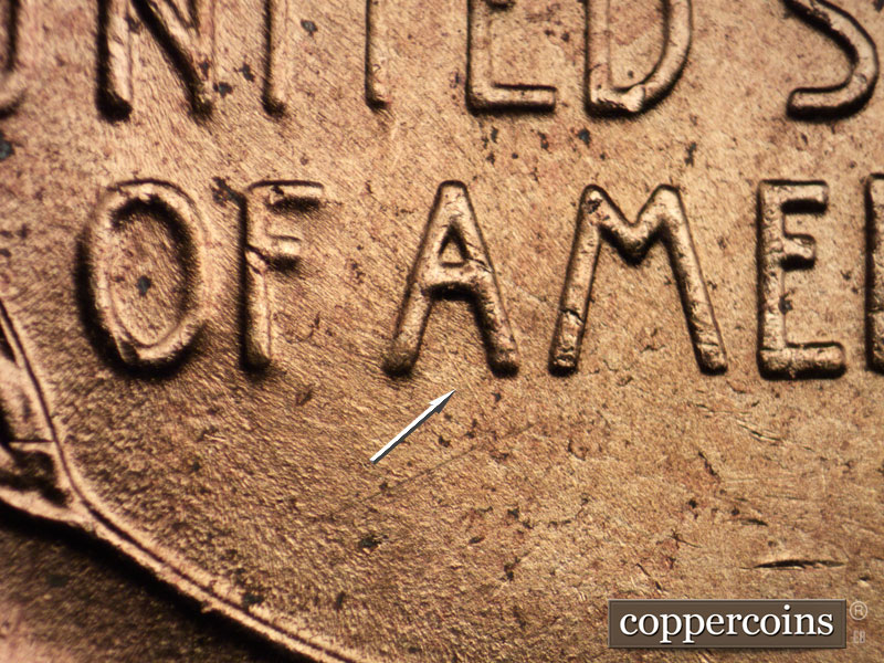 Die-stage B marker on 1956D•1DO•032 (1956 Doubled Die Obverse).