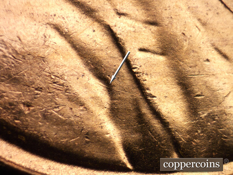 Die-stage B marker on 1956D•1DO•035 (1956 Doubled Die Obverse).