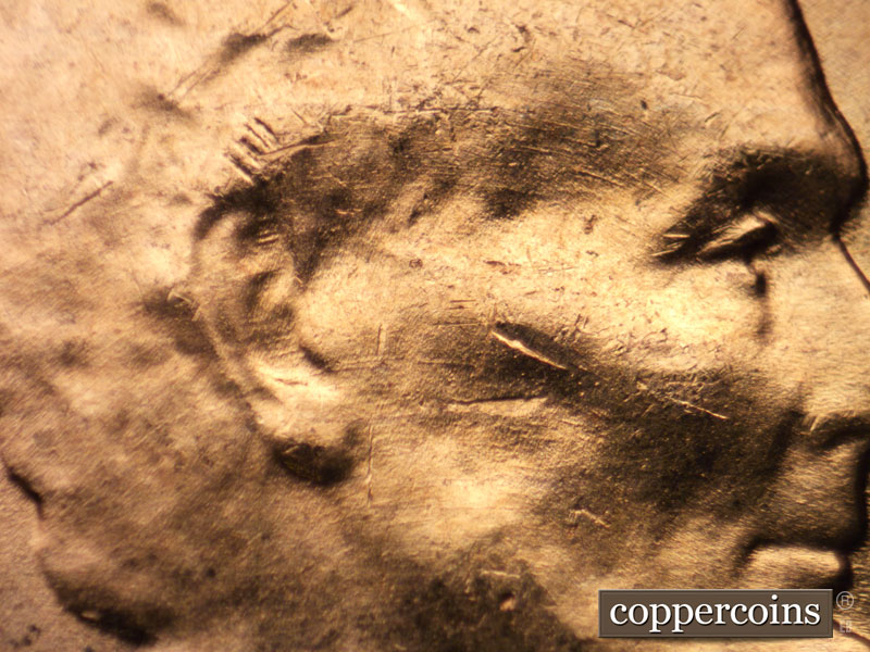 Die-stage B marker on 1956D•1DO•035 (1956 Doubled Die Obverse).