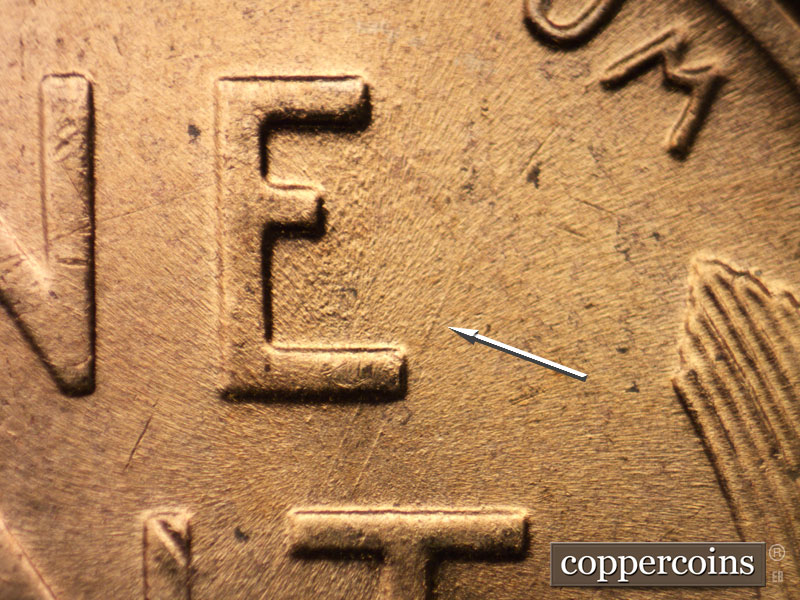 Die-stage B marker on 1956D•1DO•035 (1956 Doubled Die Obverse).