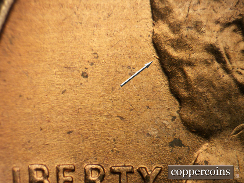 Die-stage B marker on 1956D•1DO•036 (1956 Doubled Die Obverse).