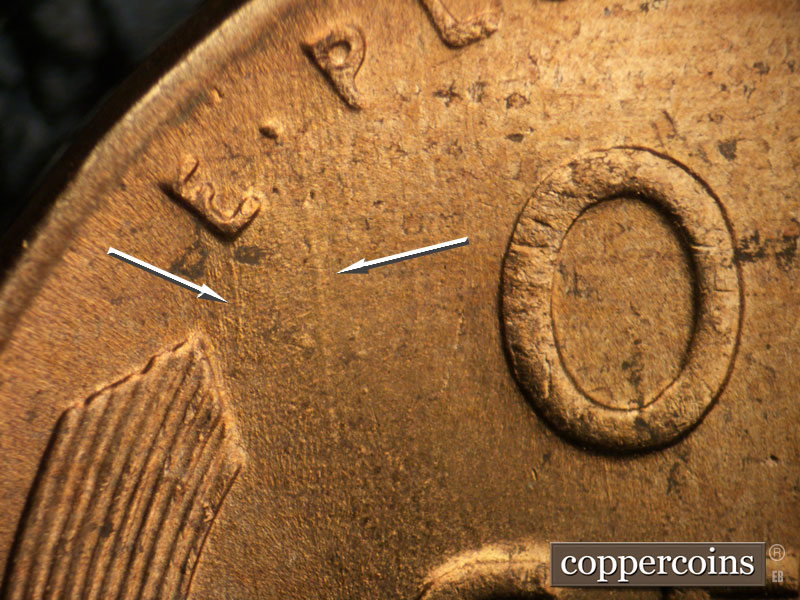 Die-stage B marker on 1956D•1DO•036 (1956 Doubled Die Obverse).