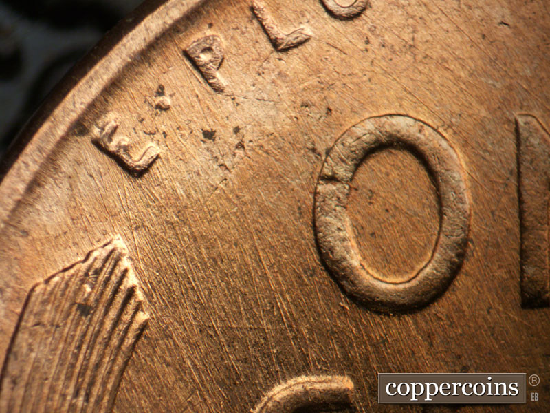 Die-stage B marker on 1956D•1DO•037 (1956 Doubled Die Obverse).