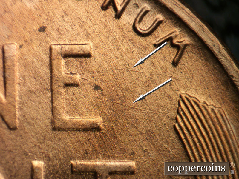 Die-stage B marker on 1956D•1DO•037 (1956 Doubled Die Obverse).