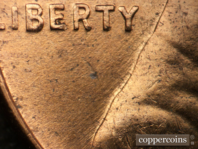Die-stage B marker on 1956D•1DO•039 (1956 Doubled Die Obverse).