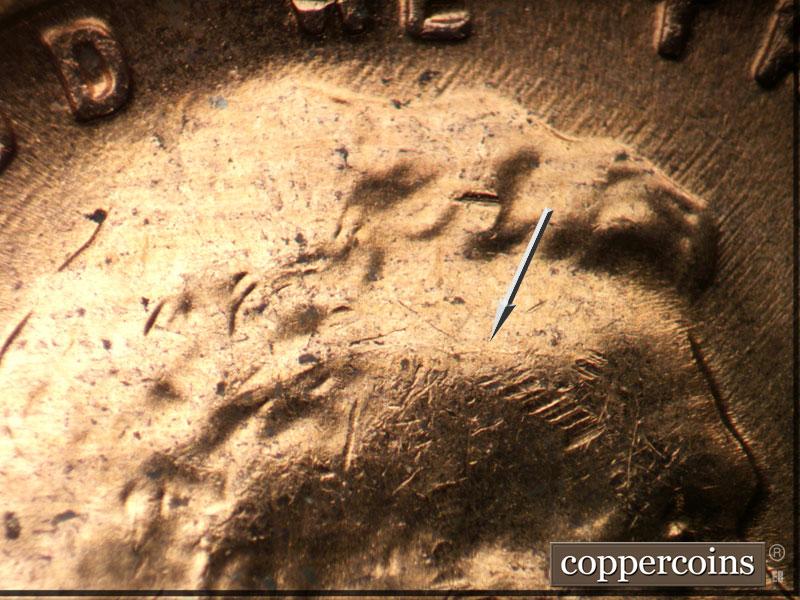 Die-stage B marker on 1956D•1DO•039 (1956 Doubled Die Obverse).