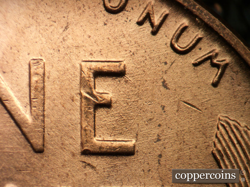 Die-stage B marker on 1956D•1DO•040 (1956 Doubled Die Obverse).