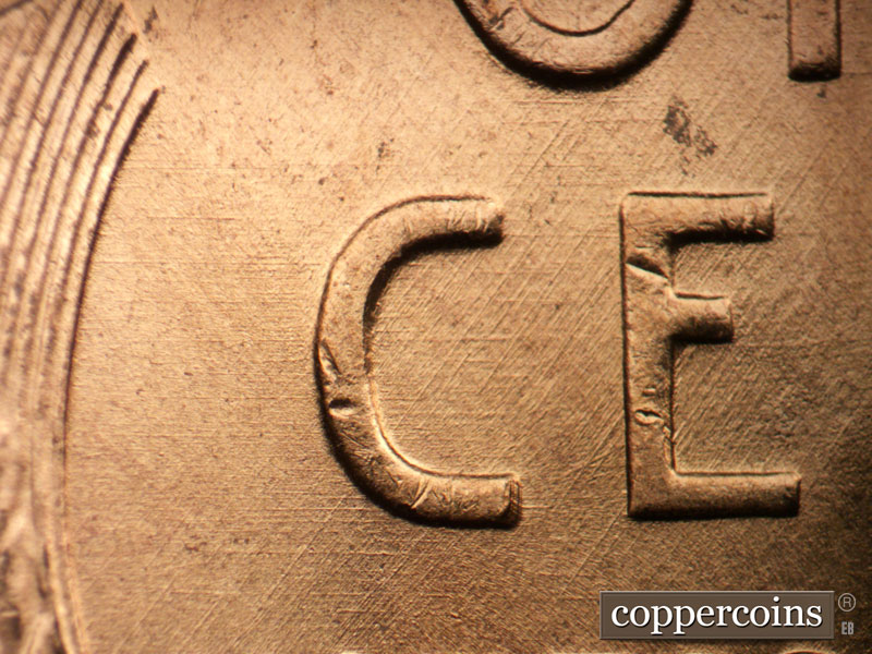Die-stage B marker on 1956D•1DO•040 (1956 Doubled Die Obverse).
