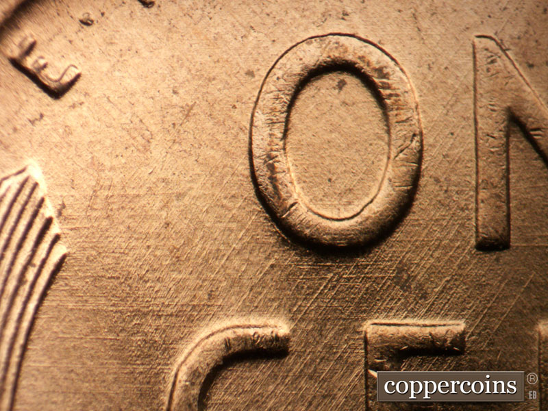 Die-stage B marker on 1956D•1DO•040 (1956 Doubled Die Obverse).