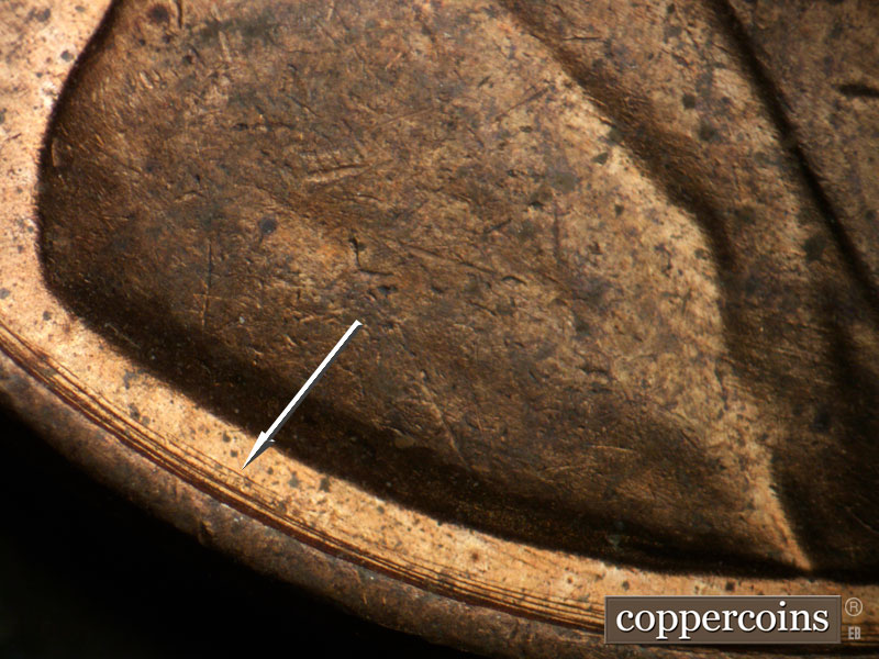 Die-stage B marker on 1956D•1DO•041 (1956 Doubled Die Obverse).