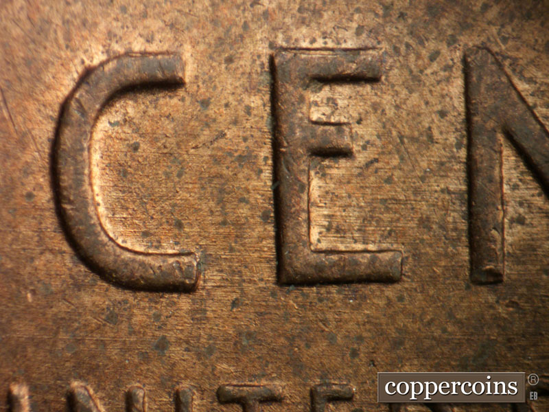 Die-stage B marker on 1956D•1DO•041 (1956 Doubled Die Obverse).