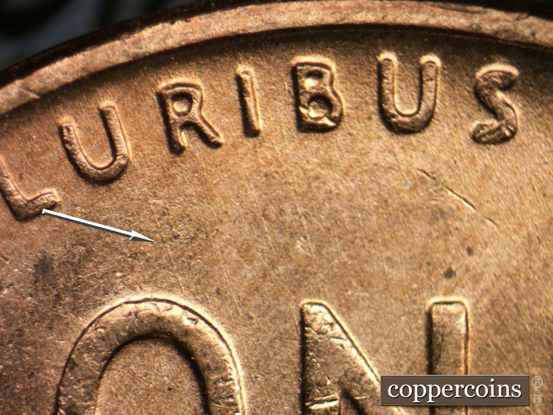 Die-stage B marker on 1956D•1DO•042 (1956 Doubled Die Obverse).