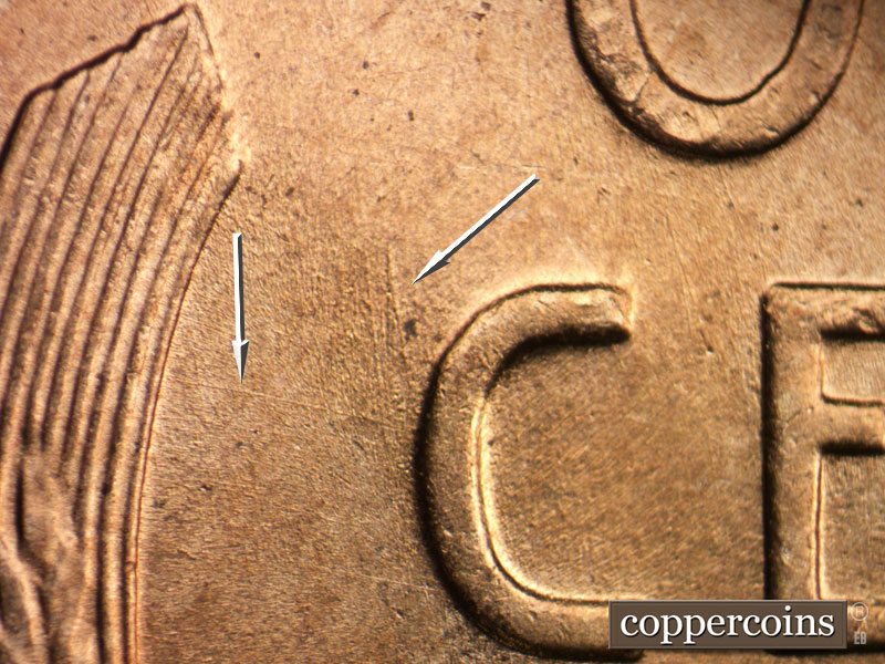 Die-stage B marker on 1956D•1DO•042 (1956 Doubled Die Obverse).