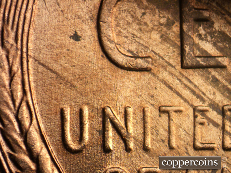Die-stage B marker on 1956D•1DO•043 (1956 Doubled Die Obverse).
