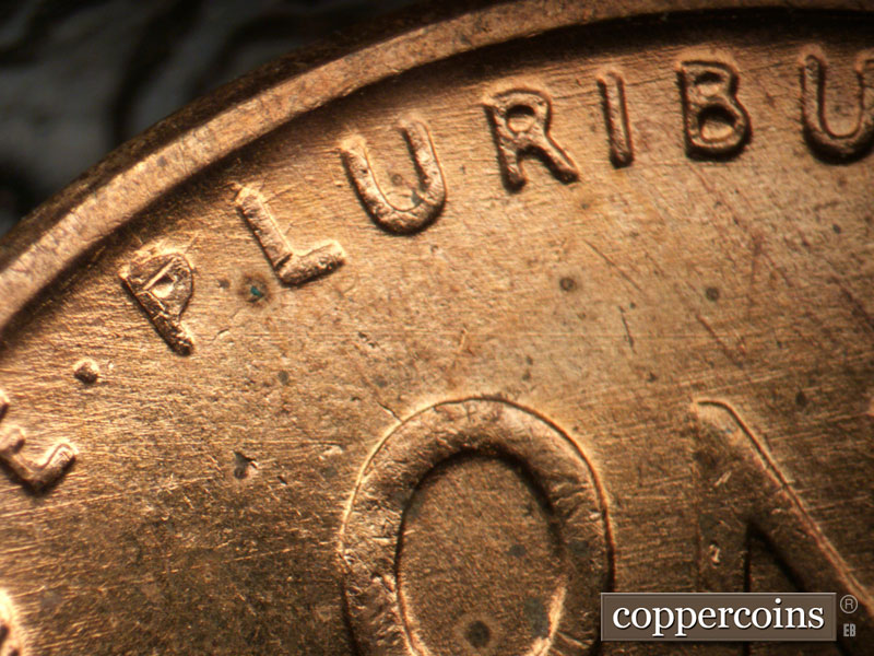 Die-stage B marker on 1956D•1DO•044 (1956 Doubled Die Obverse).