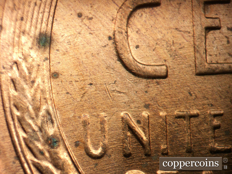 Die-stage B marker on 1956D•1DO•044 (1956 Doubled Die Obverse).